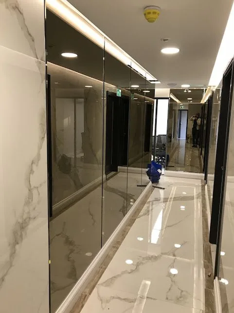 Home 9 Glass Cabinets Installed In A Pathway Of A House